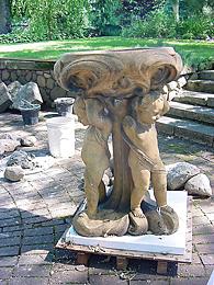 Image 1:  The top two layers of the Putti Fountain in position, showing side with break.